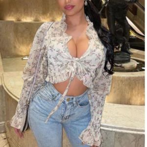 Fashion Nova. Size small. Sheer floral blouse. Never worn.